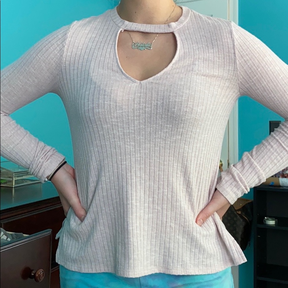 Baby pink long sleeve shirt with a neck cut out